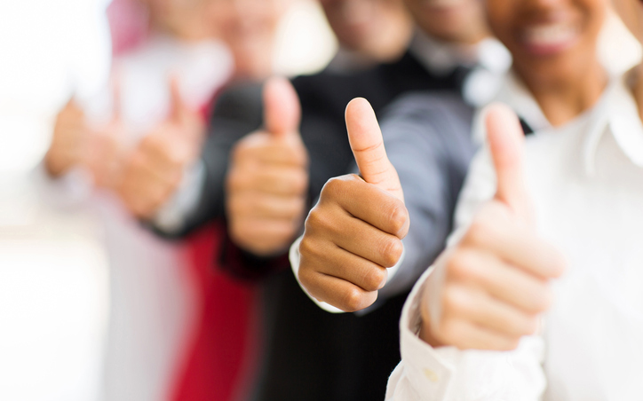 closeup photo of people giving thumbs up