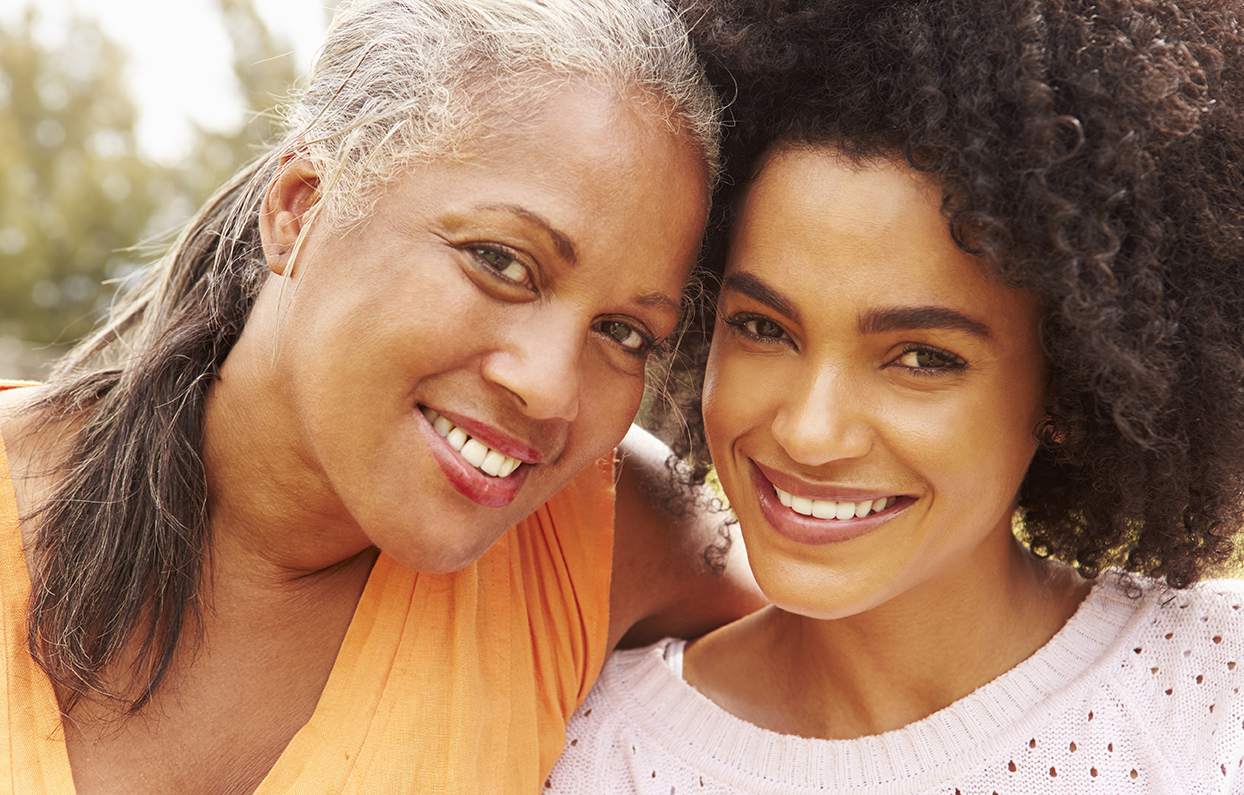 Smile mother and daughter of African heritage