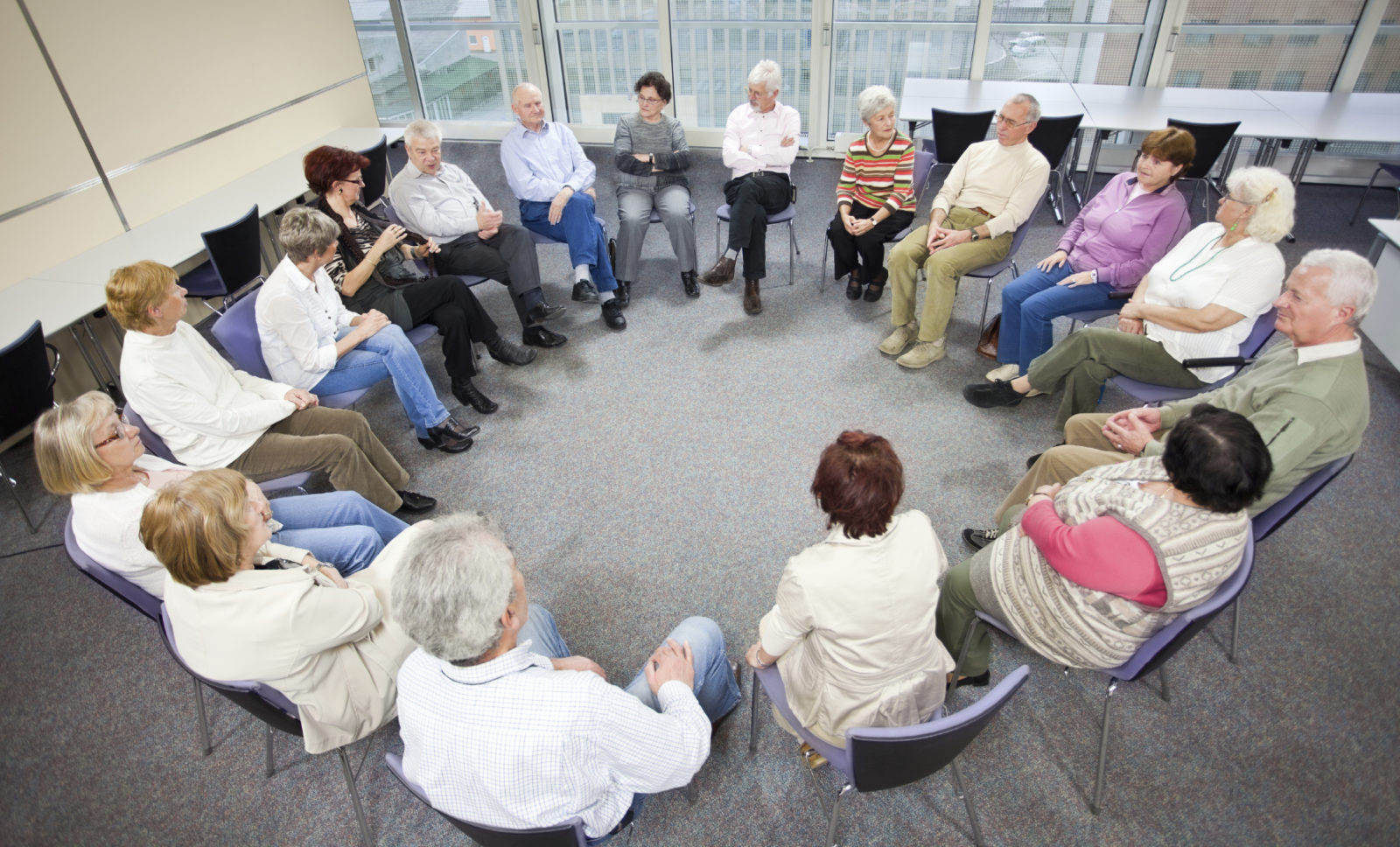 Discussion group seated on chairs in a circle