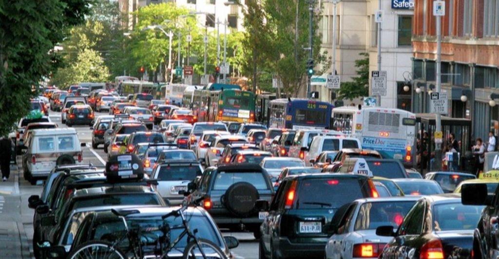 Photo of a downtown Seattle streetscape during rush hour.