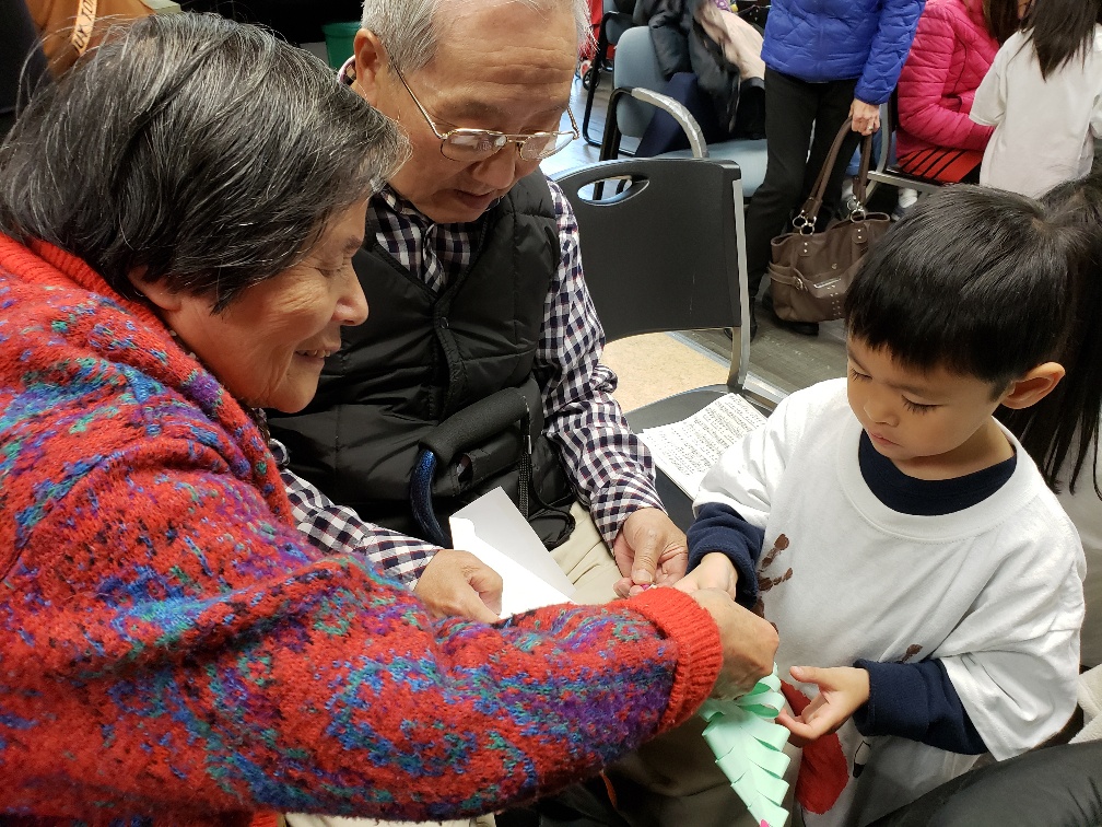 Photo shows intergenerational activity at the Chinese Information and Service Center, which received King County Veterans, Seniors & Human Services Levy (VSHSL) funding to support immigrants and their families, honoring their heritage while helping them succeed. Photo courtesy of King County VSHSL.