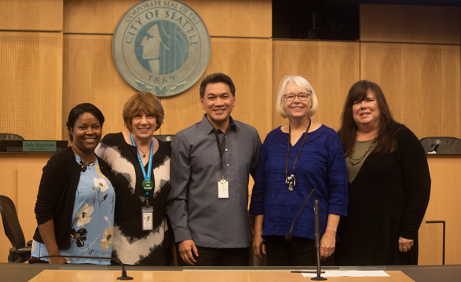 Lena Tebeau, Cathy Knight, G De Castro, Sally Bagshaw, and Cathy MacCaul following the lunch-and-learn on The Affordability of Long-Term Care in the Seattle City Council Chamber (9/4/19).
