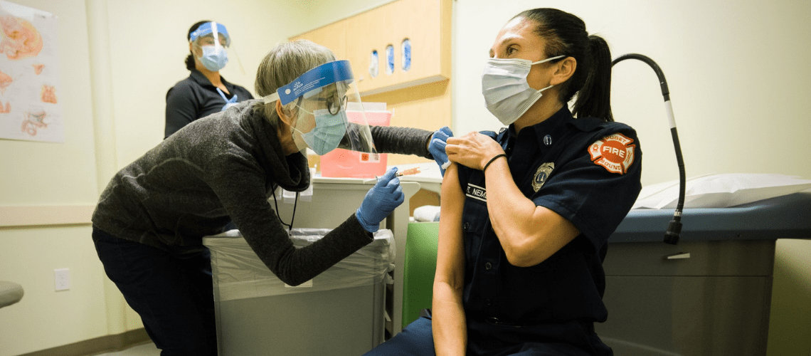 Public Health staff administer COVID vaccines