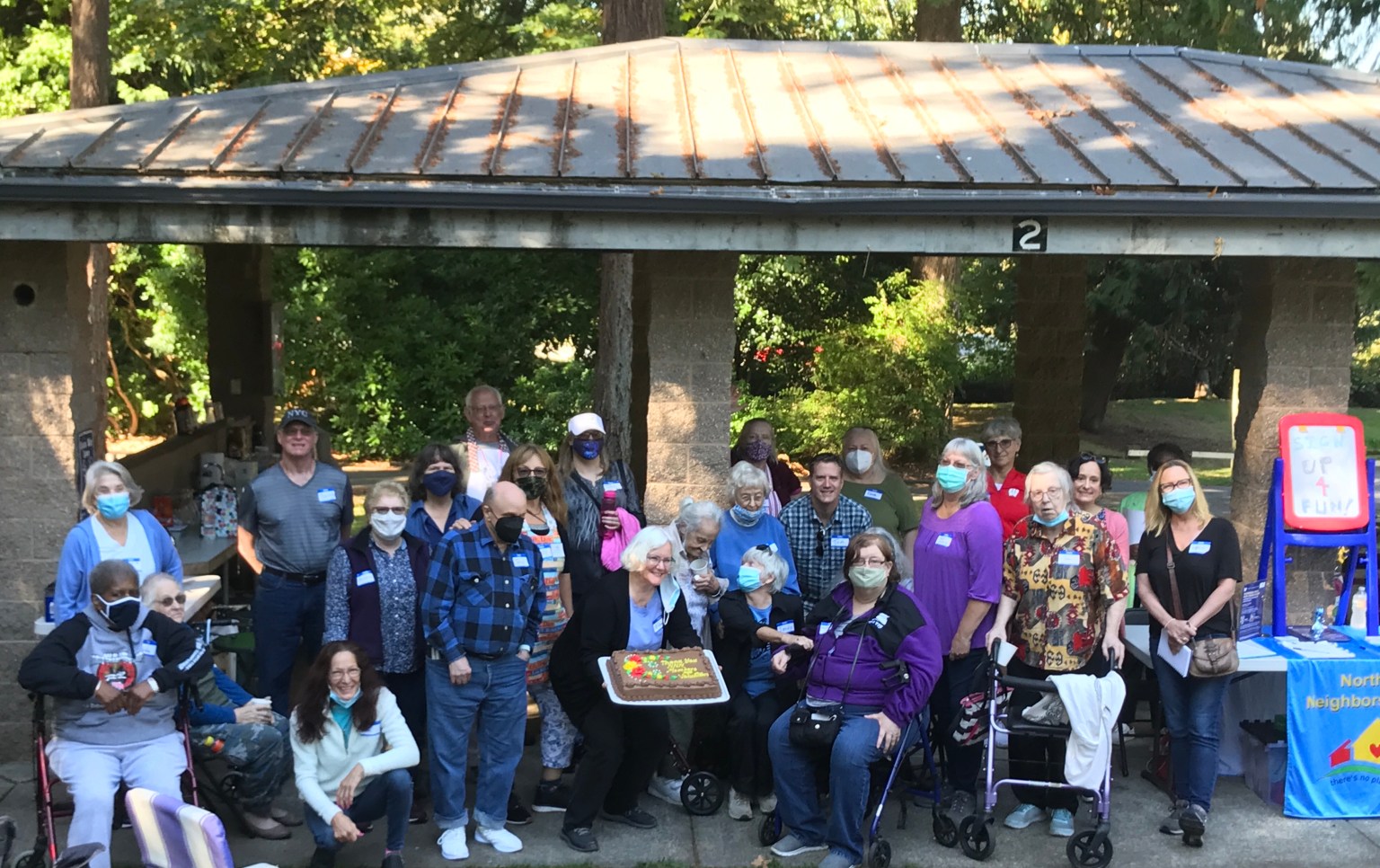 Northwest Neighbors Network members and volunteers participated in an ice cream social at a park to share time together and build community.