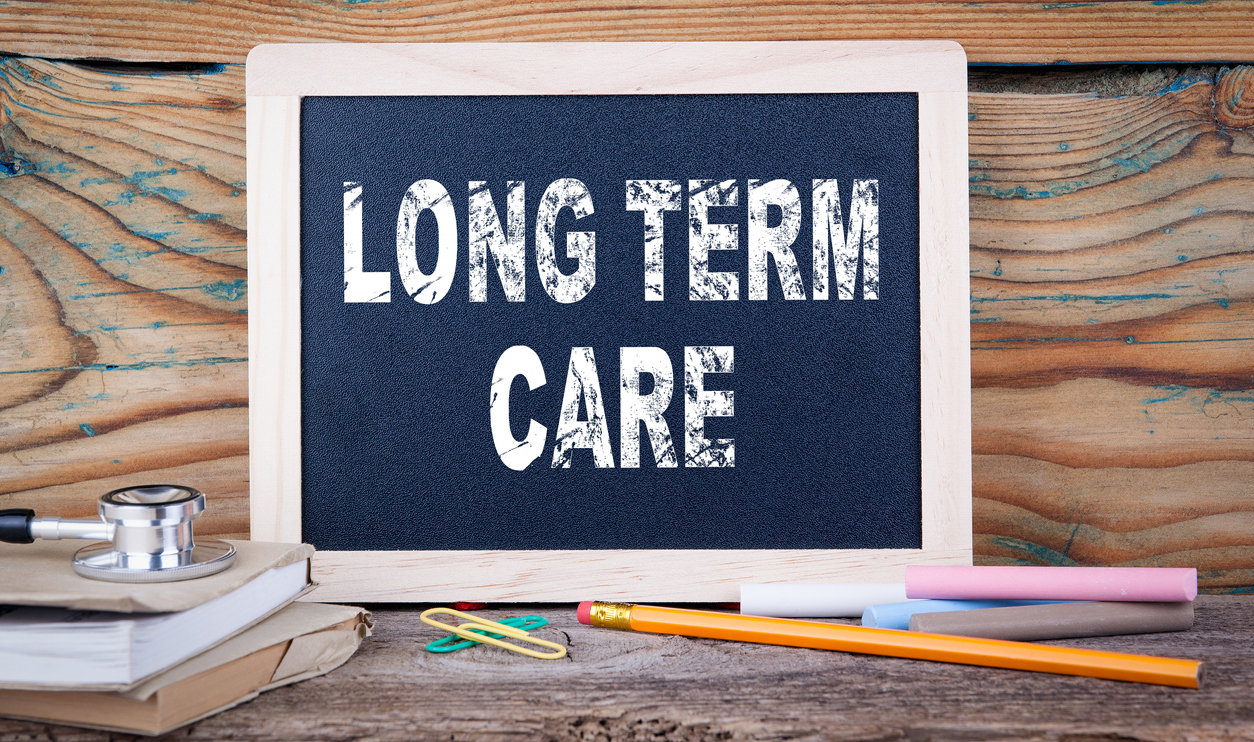 "long term care" on a Chalk board Background