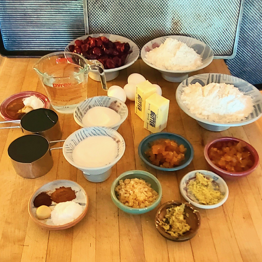 kitchen table with all ingredients needed to prepare ginger cake